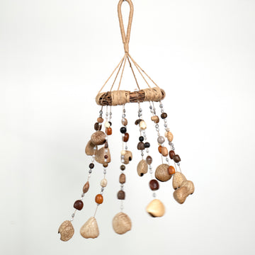 22-24 inch Forest Echo Nut Shell Chime with cascading Panji, Pudi, and Pala seeds on a rustic vine loop, organic home decor
