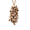 Handcrafted 74-seed Chacha shell wind chime in beige and brown on jute rope — botanical acoustic anchor for sensory grounding and sound healing