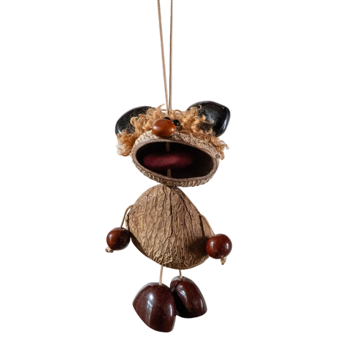 Handcrafted whimsical figure bag charm made from natural nut shells and botanical seeds — quirky boho nature accessory