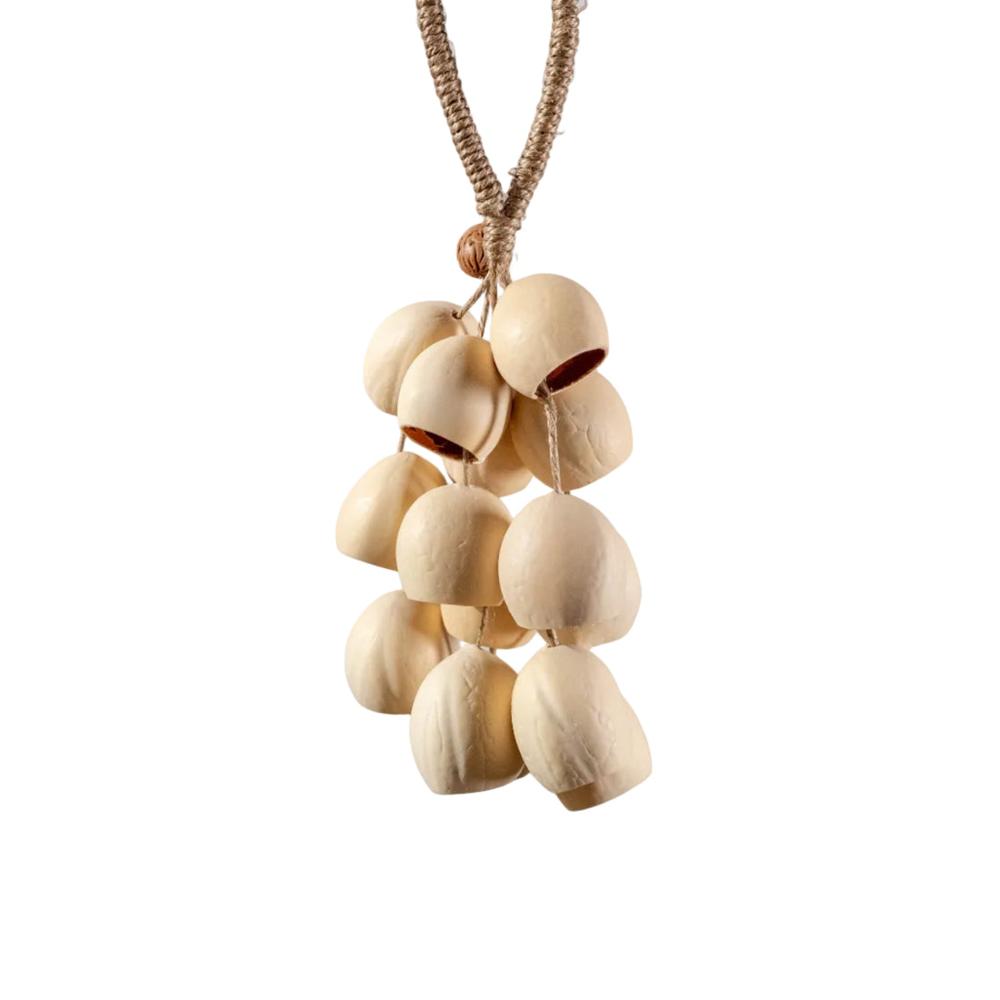 Handcrafted bag charm with 15 cream-colored Phoenix Egg botanical shells and peach pit accent on braided hemp loop — boho nature accessory