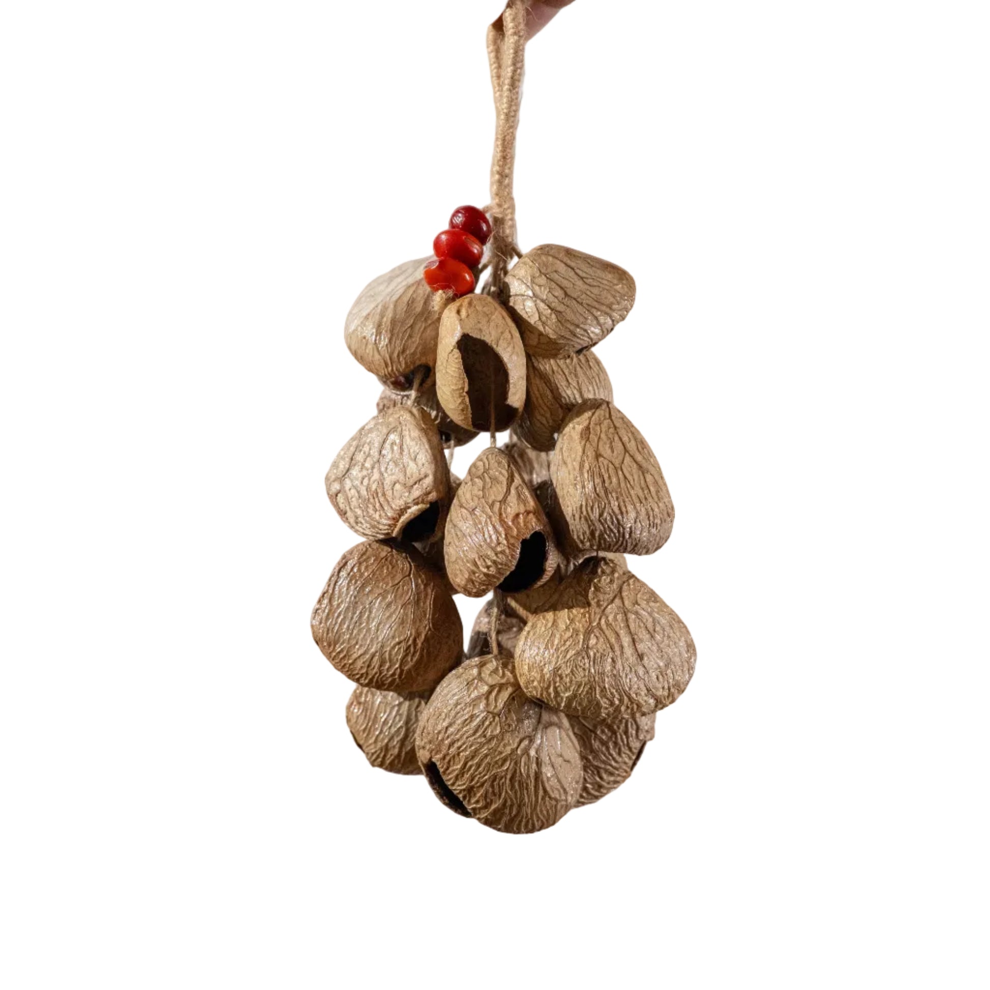 Handcrafted 18-seed Panji nut wind chime with red bean accents on hemp rope — botanical sound healing home decor
