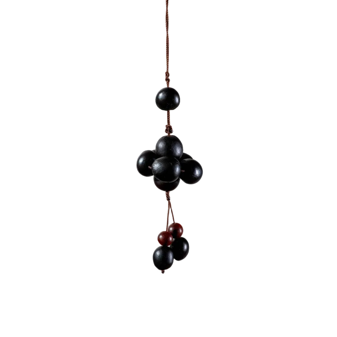 Handcrafted Zen bag charm featuring 10 dark, round Soapnuts (Wu Huan Zi) arranged in a cluster with a braided brown cord loop.