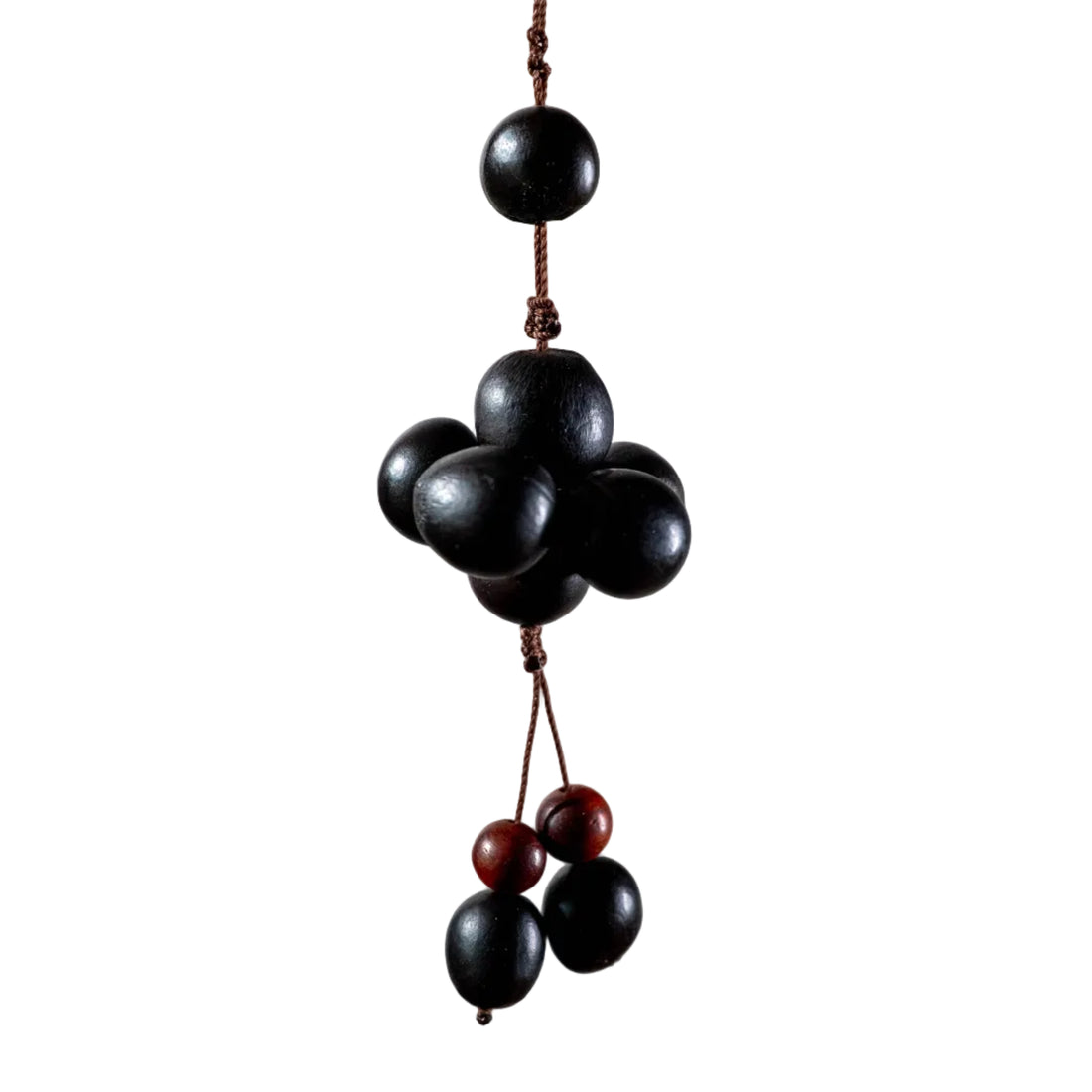 Handcrafted Zen bag charm featuring 10 dark, round Soapnuts (Wu Huan Zi) arranged in a cluster with a braided brown cord loop.