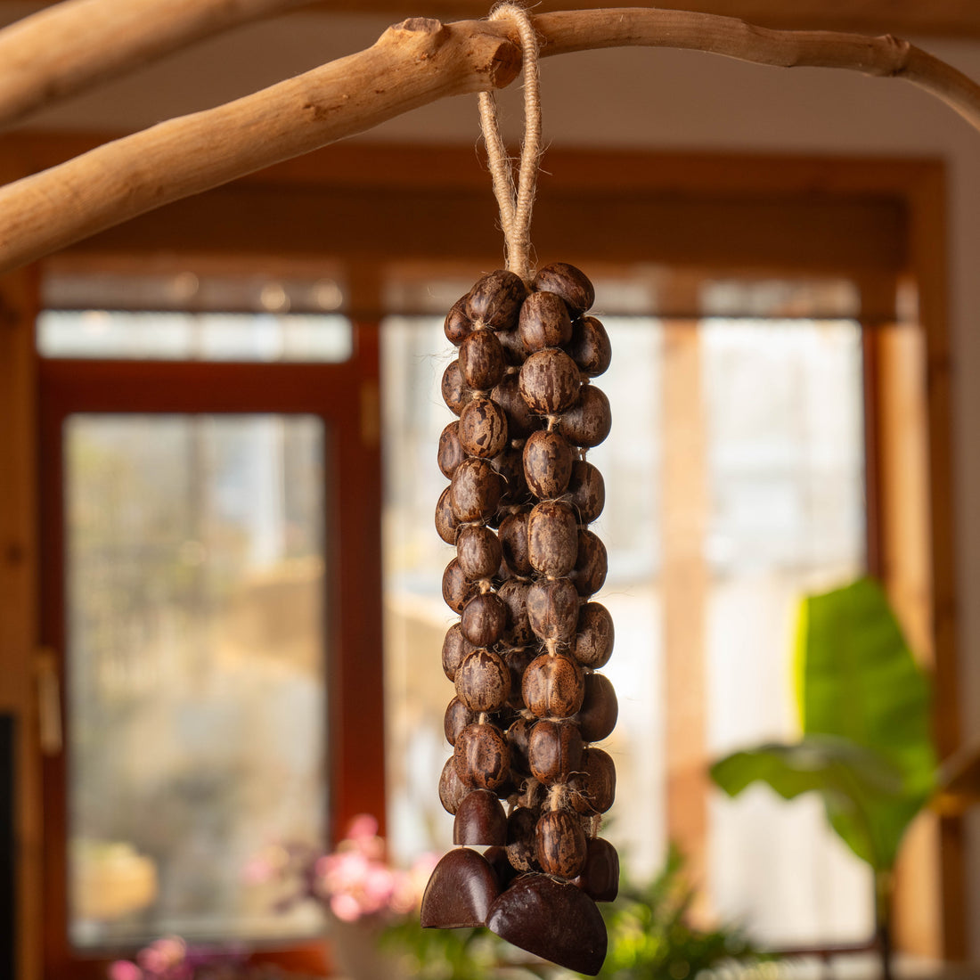 Large 71-seed botanical wind chime with Pala nuts and Juju seeds on hemp rope — professional sound healing and meditation decor