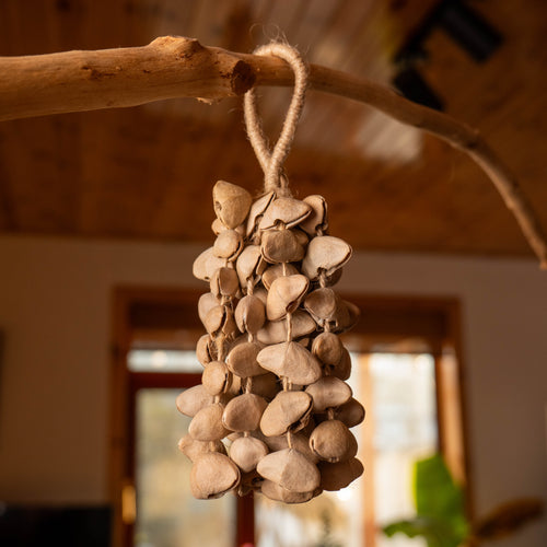 74-piece natural Chacha shell wind chime, acoustic anchor for sensory grounding and noise masking.