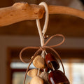 Handcrafted natural seed pod door chime with Salin, Juju and Chacha nuts on jute rope — botanical zen decor and meaningful gift