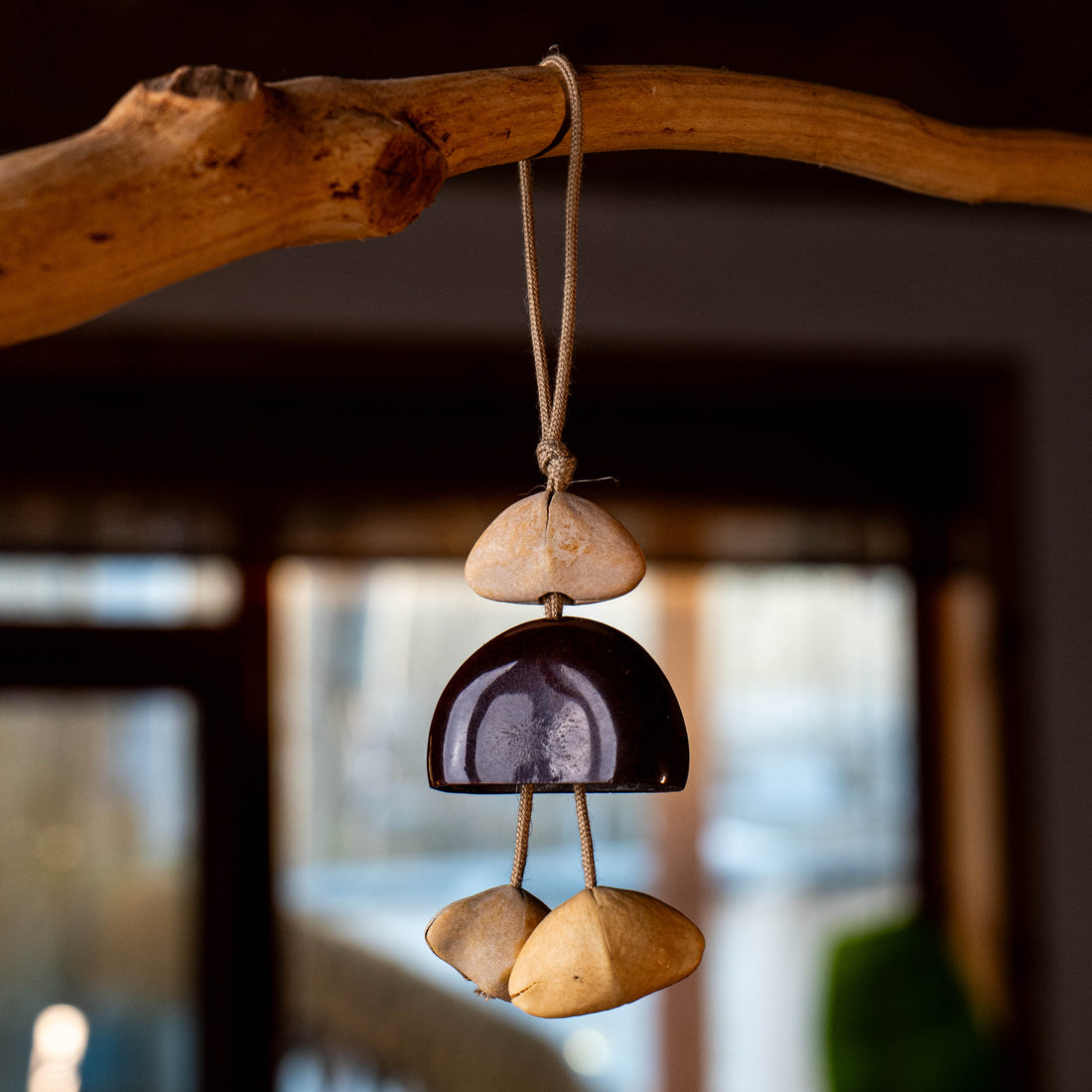 Handcrafted 24-element botanical bag charm in two colorways — beige and brown nut shell acoustic accessory for handbags and backpacks