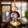 Handcrafted 24-element botanical bag charm in two colorways — beige and brown nut shell acoustic accessory for handbags and backpacks